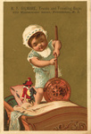 Untitled (baby holding bed warmer)