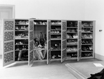 Shoes, Parasols, and Umbrellas in Cabinet in Storage by Robert O. Thornton, RISD Museum Photographer and RISD Archives